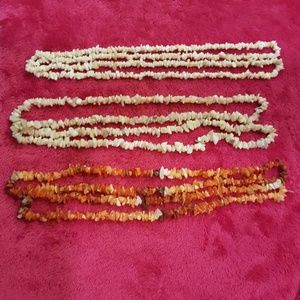 3 stands. 1 fire opal, 1 opal, and 1 coral.